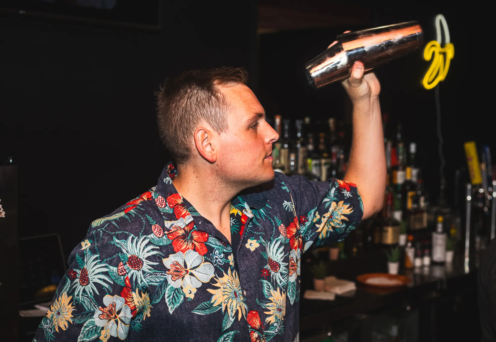 Bartender preparing a cocktail for hospitality brand photography