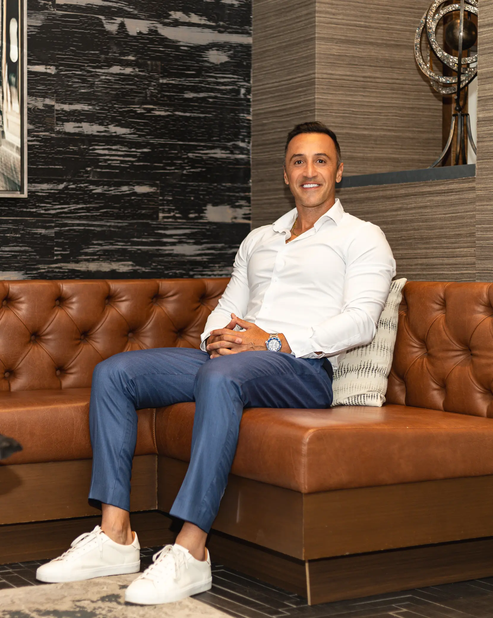 Personal branding portrait seated in a leather chair